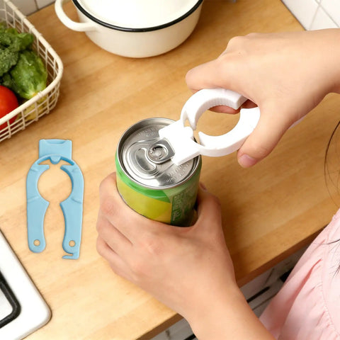 Using Six Pack Plastic Bottle Cap Opener Set 3 In 1 Gripper Tool For Arthritic Hands on a can, with spare opener on counter