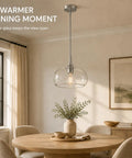 HXXLFONEDP Glass Pendant Light for Kitchen Island, 10 Inch, Brushed Nickel hanging over a wooden dining table with clear glass shade.