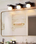 Lit Bath Wall Light With Three Flame Glass Lampshade G9 Cabinet Chandeliers For Bathroom above mirror in modern bathroom.