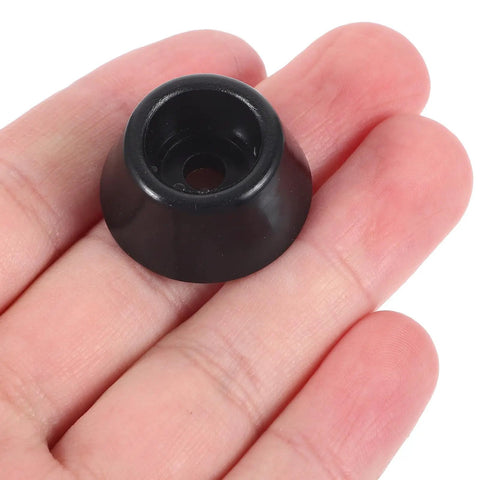 Hand holding a single piece from the 20 Pack Rubber Furniture Feet Pads with Stainless Steel Washers, Easy Install Grippy Non Slip Anti Skid Leg Caps.