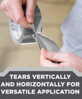 Close-up of person tearing Heavy Duty Duct Tape 1.88 in x 45 yd (2 Rolls), Multi-Surface Industrial Adhesive vertically by hand.