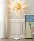 Artichoke Design 68 Inch Tall Free Standing LED Floor Lamp With Multi Panel Wooden Shade illuminating a modern living room corner