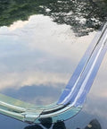 Installed clear sunroof sealing tape for leak prevention and waterproof repair on panoramic sunroof, close-up view.