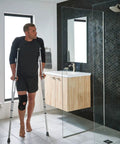 Man with crutches next to the Check Out This Rock Solid Twelve Inch Bathroom Grab Bar In Brushed Nickel Finish On Stainless Steel That Gives You Awesome Support Up To Five Hundred Pounds For Top Notch Safety In The Shower Or Bath Ada Compliant Design With One And A Quarter Inch in modern bathroom
