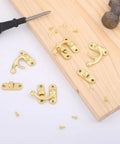 Hella Smooth Swing Arm Latches For Jewelry Boxes Top Shelf Antique Gold Clasps With No Sweat Setup On Mini Cabinets And Craft Drawers Totally Legit Vintage Hardware on wood with screws.