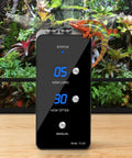 Terrarium scene with Reptile Humidifier Misting System For Terrariums Must Have Automatic Operation, black unit with lizard on top