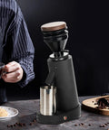 Game Changer Electric Coffee Grinder With Forty Millimeter Stainless Steel Conical Burrs And Nineteen Adjustable Grind Sizes For Perfect Drip French Press And Cold Brew Coffee Setup with stainless steel hopper.