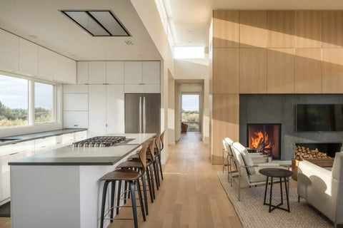 Modern kitchen and living area featuring wood paneling and a fireplace, showcasing White Oak Rift Wood Veneer Sheet 24x48 Peel And Stick A Grade Veneer Face Ready To Stain Quick Apply 3M Self Adhesive Oak Veneer For Furniture Restoration Cabinets And Woodworking.