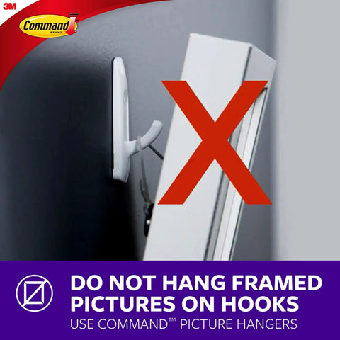 Side view of a wall with a picture frame improperly hung on a white hook, red X indicating incorrect use of Command hooks.