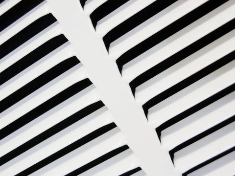 Close-up of 12 Inch By 6 Inch Duct Opening Flat Stamped Steel Return Air Grille slats in white finish for sidewall and ceiling