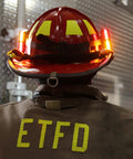 Firefighter wearing Helmet Strap Mount Accessory With Two Magnetic Mounts And Screw In Feature For Hard Hats And Fire Safety Helmets