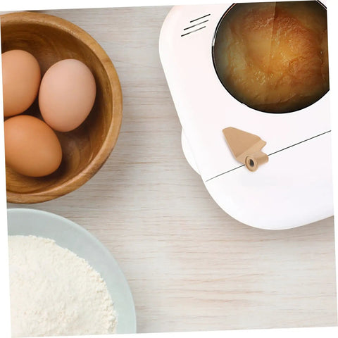 Stirring Paddle Replacement For Bread Maker next to eggs and flour, showcasing kneading functions for homemade loaves