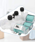 Washer water inlet valve assembly with three ports and teal solenoids, white plastic body, angled front view