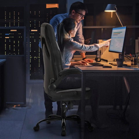 Ergonomic Gaming Desk Chair With PU Leather Upholstery in an office setting, showcasing lumbar support and flip-up armrests.