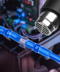 Blue solder-seal butt connector on blue automotive wire for electrical splice.