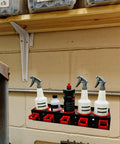 Extra Sturdy Carbon Steel Wall Storage Rack for Spray Bottles and Workshop Tools Built Like a Beast with Hella Room for Clutter and Easy Installation Anywhere in Your Space, displaying spray bottles and tools.