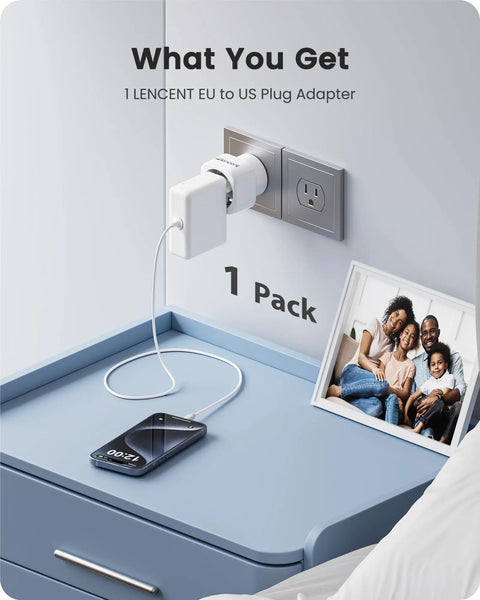 Europe to US Plug Adapter for Travel No Fuss EU to US Converter plugged into wall socket next to phone on table
