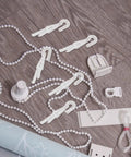 Rock Solid 12 Piece Blind Wand Replacement Hooks Built With Heavy Duty Alloy For Smooth Tilt Action And Fast Window Treatment Repairs Around Your Place on a wooden surface with accessories.