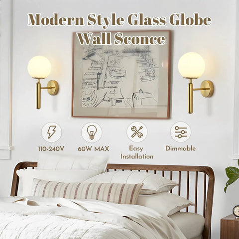 Bedroom with two milk glass globe wall sconces with brushed brass body in mid century modern gold finish above bed