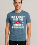 Man wearing Funny DIY Mechanic T Shirt For Men I Watched A YouTube Video Design Indigo Blue Casual Workwear Tee standing front view.