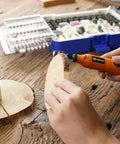 Person using rotary tool from Must-Have Rotary Tool Bits Kit For Dremel And Other Brands, 508-Piece Universal Set for wood carving