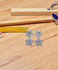 Heavy Duty Aluminum Cylinder Regulator Handwheel 6 Pack Hexagonal Valve Handle For Gas Bottles With High Torque Grip And Slip Proof Design Making Industrial Maintenance A Breeze, four silver valve handles on wood