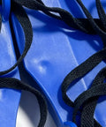 Close-up of Lawn Aeration Sandals With Adjustable Fit, Heavy Duty Spike Shoes For Easy DIY Lawn Care, featuring blue plastic straps and black laces