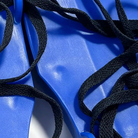 Close-up of Lawn Aeration Sandals With Adjustable Fit, Heavy Duty Spike Shoes For Easy DIY Lawn Care, featuring blue plastic straps and black laces