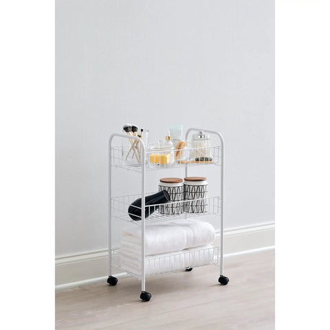 Three Tier Wheeled Wire Shelving Cart With Adjustable Metal Shelves holding toiletries and towels in a domestic setting.