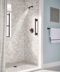 Brantford Oil Rubbed Bronze Posi-Temp Shower Trim Kit with showerhead and lever handle in elegant bathroom setting