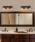 Farmhouse Mason Jar Vanity Light Fixtures in Oil Rubbed Bronze Finish for Bathroom and Foyer above double sink, mirror reflection.