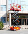 Heavy Duty Hydraulic Lift Platform With Safety Rails Built Like A Tank For Shop Use raised outdoors at building entrance.