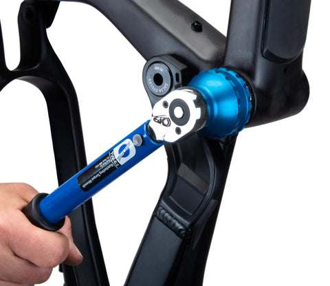 Using Blue Anodized Bottom Bracket And Pedal Tool With Laser Engraving, 3/8 Drive, 44mm, 16 Notch Socket on bike frame