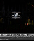 Reflective No Soliciting Sign For Home Or Biz 12x8 Inch Rust Free Aluminum Sign on fence at night