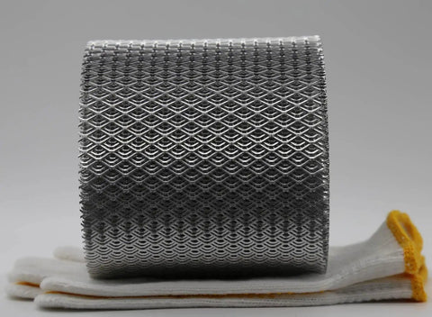 Thickened Aluminum Gutter Guard Roll, Heavy Duty Leaf Filter Shield for 5 Inch Gutters, 21 Feet, resting on gloves