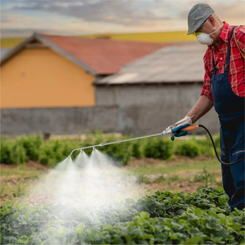 Heavy Duty Sprayer Wand With Three Nozzles For Flexible Garden And Lawn Care in use spraying plants in a garden