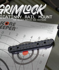 Grimlock Picatinny Rail Mount For Mossberg Shotguns 500 590 835 930 Shockwave on shooting target background