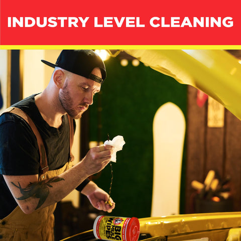 Mechanic using Oversized 10X12 Cleaning Wipes For All Purpose Garage And Auto Cleanup Ink Paint Tar Grime Remover in workshop