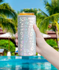 Laser Leopard Skinny Can Cooler Made With Double Wall Vacuum Insulated Stainless Steel To Keep Your Twelve Ounce Tall Boys Frosty All Night Long, held by a hand near a pool.