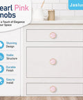Six Pack Pink Shell Cabinet Knobs Set, 1-1/4 Inch Round Dresser Pulls In Zinc Alloy With Brushed Brass Finish on white drawers.