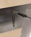 Dual Head Hammerless Nail Setter And 3/16 In Center Punch With 3500 PSI Striking Force on metal surface