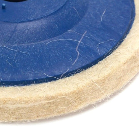 Close-up of Heavy Duty 3 Pack Felt Wool Buffing Wheel For Angle Grinder, soft blue pad for polishing marble and metal surfaces.