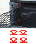 Rock Solid Carbon Steel Tie Down Hooks Four Pack For Ford Maverick 2022 To 2025, red cleat anchors with a net in truck bed.