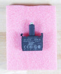 Green 24V Power Module With LED Pilot Light D7N3G resting on pink foam for industrial control panels