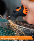 Close-up view of an orange and black rotary tool grinding metal, sparks flying from a cutting disc