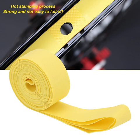 Yellow PVC rim tape detail on mountain bike wheel, showing secure fit. 2 Pack PVC Rim Tape for 26 Inch Mountain Bikes High Elasticity Puncture Proof Inner Tube Protector Rim Strip Shield Prevent Spokes Punctures and Tire Damage.