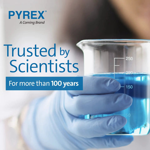 Gloved hand holding a Pyrex glass beaker with blue liquid, emphasizing laboratory precision and trust by scientists.