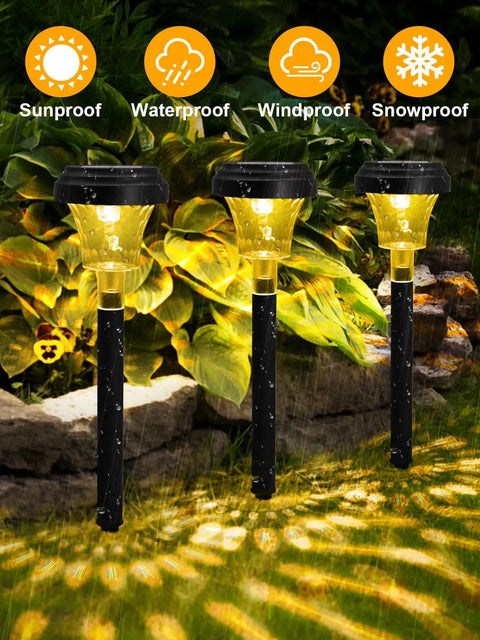 Three illuminated Seven Pack Solar Pathway Lights With RGB Color Changing And A Lit Warm White Glow IP67 Waterproof Outdoor Path Lights