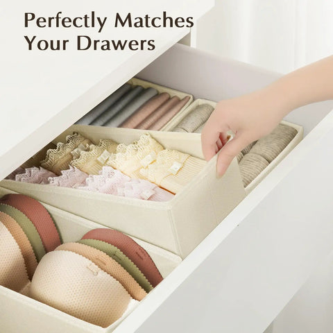 Fabric Drawer Organizers For Clothes, Dresser Bins With Adjustable Divider Panels, Closet Storage Cubes For Baby Knickknacks And Underwear, Beige Four Pack holding bras and socks in a drawer.
