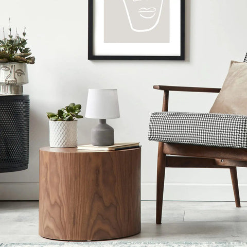 Gray Concrete Table Lamp With White Fabric Shade on wooden table in living room.